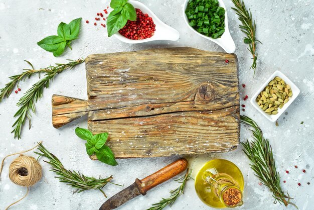 Fresh herbs and ingredients on wooden board